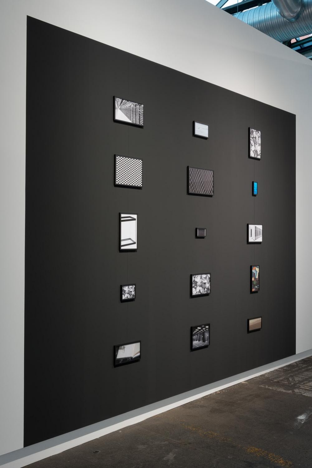 Sean Snyder Aspect Ratio (Topaz), 2015-2016 15 color and b/w archival pigment prints on matte paper, various formats, 1 cm black aluminum frame, on 300 cm high x 400 cm wide wall painted RAL 9017