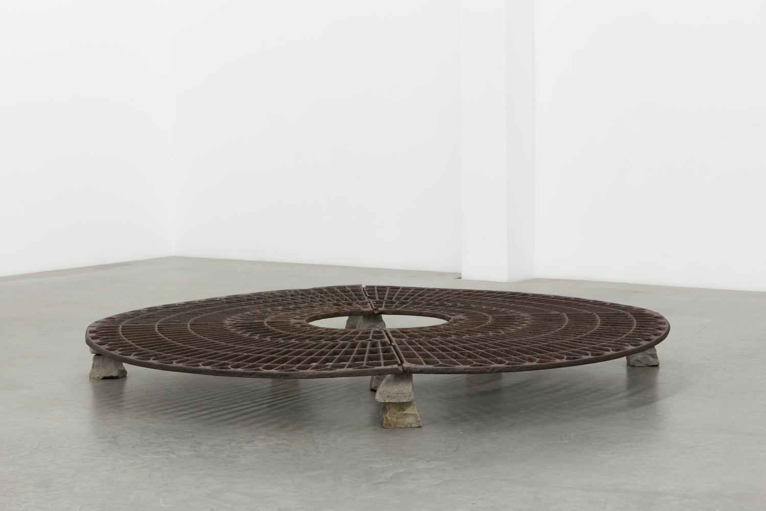 Claire Fontaine Grille (360°), 2016 Four cast iron elements and sixteen paving stones, h=21, ø 200 cm  