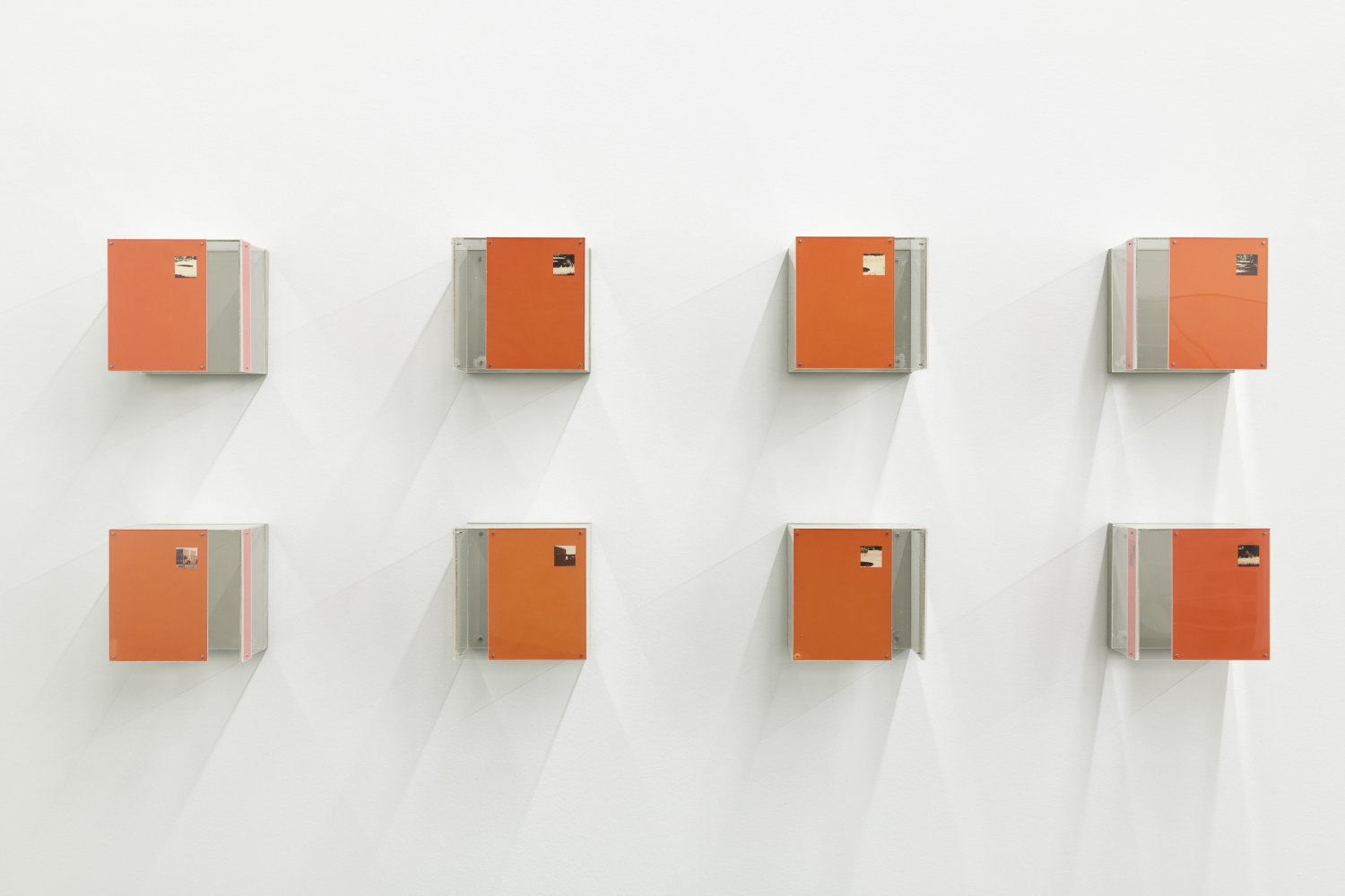 Tom Burr, Eight Orange Boxes, 1989 Plexiglass, photographs, 8 elements, each 20.5 x 18 x 21 cm