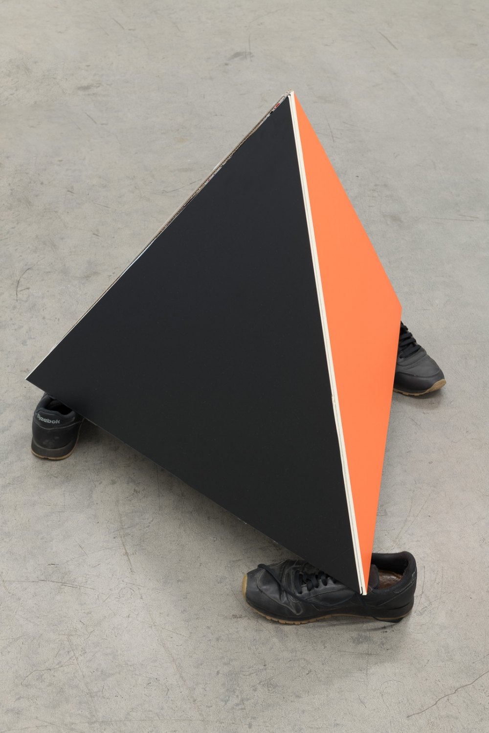 Karl Holmqvist Untitled (Foam core board pyramid), 2021 Gift wrapping paper and self-adhesive colored film on foam core board, gaffa tape, shoes dimensions variable