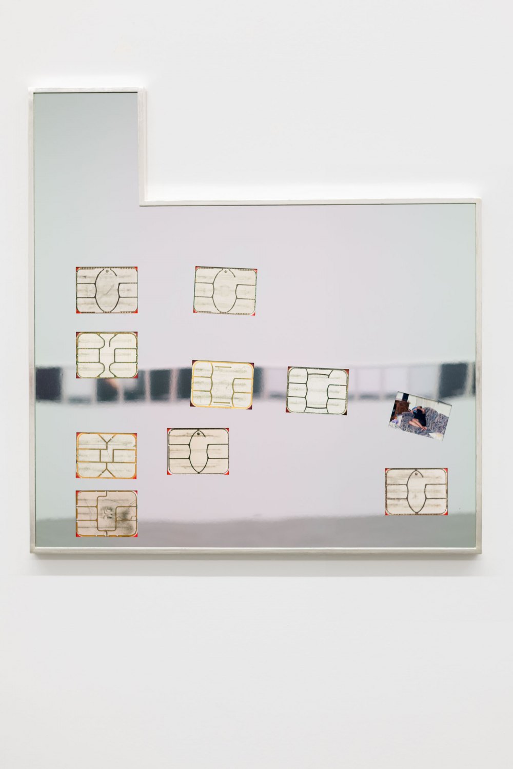 Flagged Identity (5), 2021 Archival pigment prints of my active and inactivebank cards chips, found photo, mirror finished stainless steel, and white gold leafed frame 126 x 121.5 x 6 cm