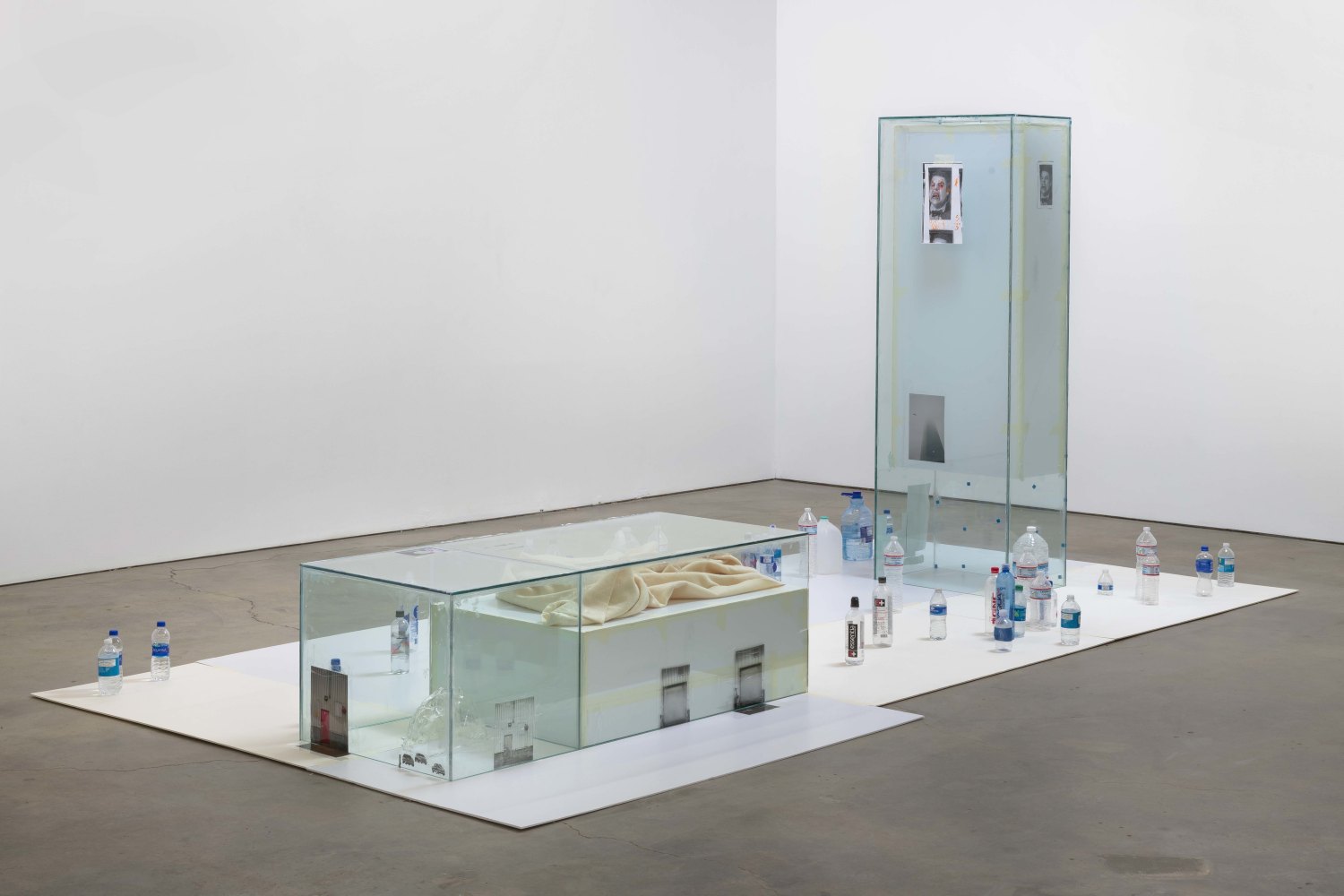 Win McCarthy Bloodsucker Country Pt. 1 & 2, 2019 Tempered glass, silicone, tape, foamcore, cast glass, laser prints, inkjet prints, blanket, water bottles 207 x 490 x 245 cm 