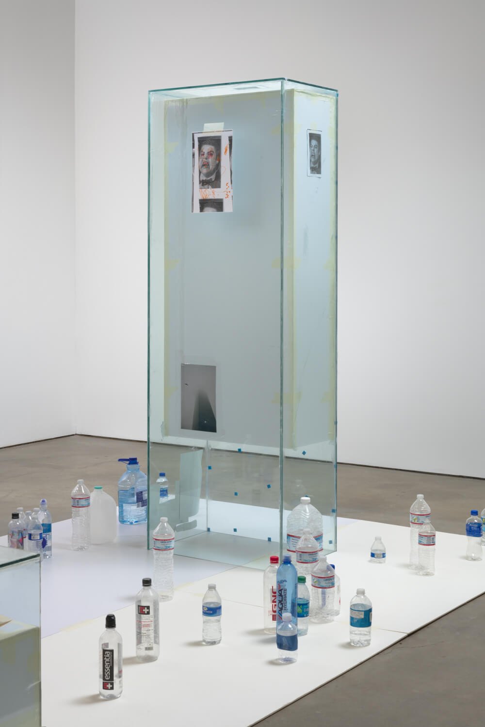 Win McCarthy  Bloodsucker Country Pt. 1 & 2, 2019  Tempered glass, silicone, tape, foamcore, cast glass, laser prints, inkjet prints, blanket, water bottles  207 x 490 x 245 cm