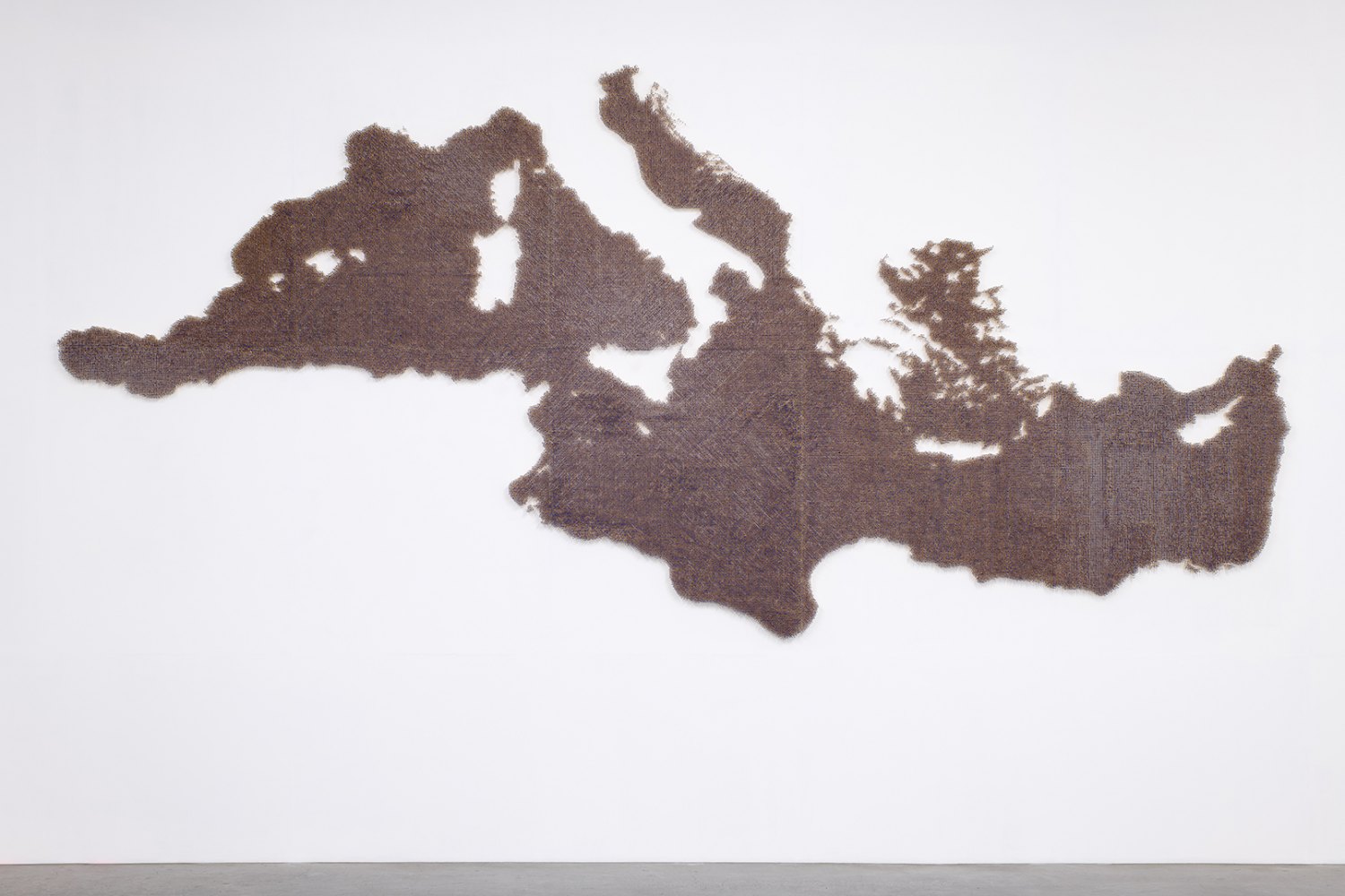 Claire Fontaine  Mediterranean Sea (Unburnt/ Burnt), 2023 Burnt/unburnt matchsticks, dimensions variable 288 x 600 cm, dimensions variable