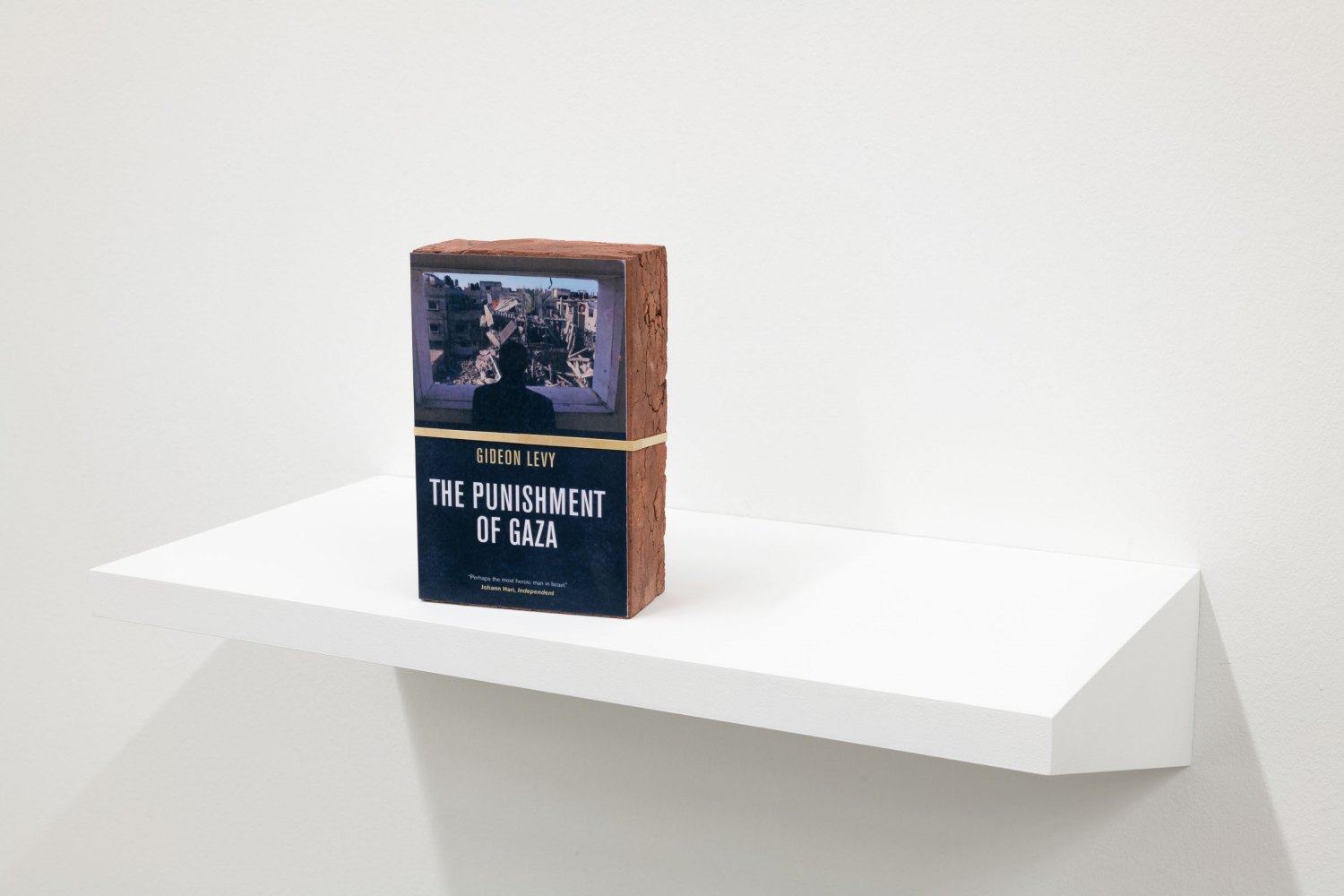 Claire Fontaine The Punishment of Gaza brickbat, 2014 Brick, brick fragments and digital archival printwith optional elastic band 20 x 13.2 x 6 cm