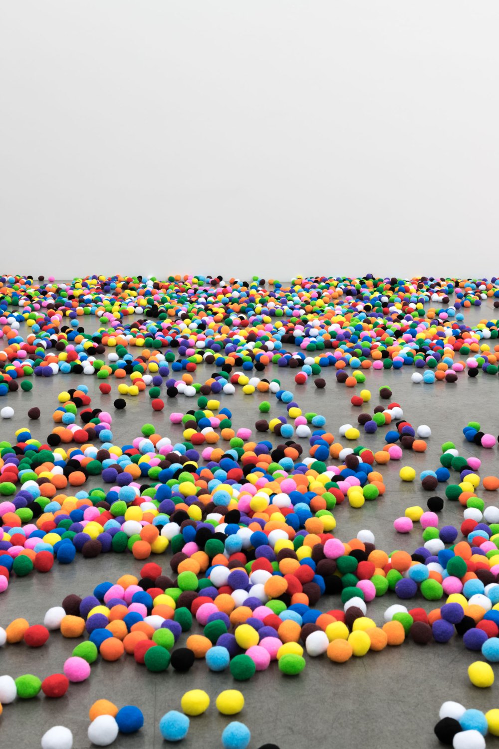 decentralized portrait selves, 2025 one pompom for each day I’ve been alive up until the display of,  2 inch Pom Pom balls (12.901) dimensions variable