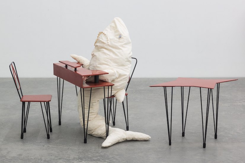HAI AM TISCH 1, 2014 Iron, blockboard, lacquer, rubber, cotton, terry, foam material, polyfill, bulb with fitting, cable, galvanized steel180 x 50 x 30 cm (shark); 85 x 74 x 34 cm (table); 99 x 59,5 x 64 cm (table); 31 x 76 x 40 cm (chairs)