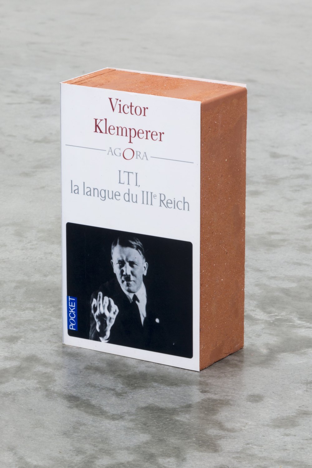 Claire Fontaine LTI, la langue du IIIème Reich brickbat, 2014 Brick fragments and digital archival print with optional elastic band, 17.8 × 10.8 × 5.8 cm