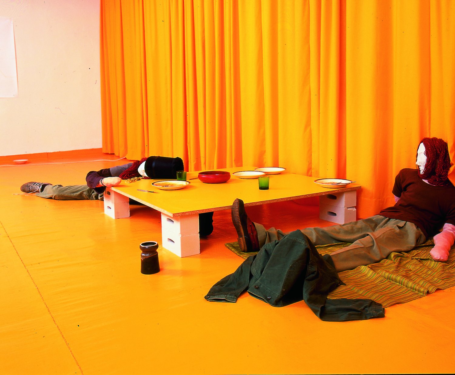 Kai Althoff REFLUX LUX, 1998 Two lifesize figures, table, plates, different jars, TV, video tape, cassette recorder, curtain, bar stool, clothes, 8 bubblejets, drawings, dimensions variable 