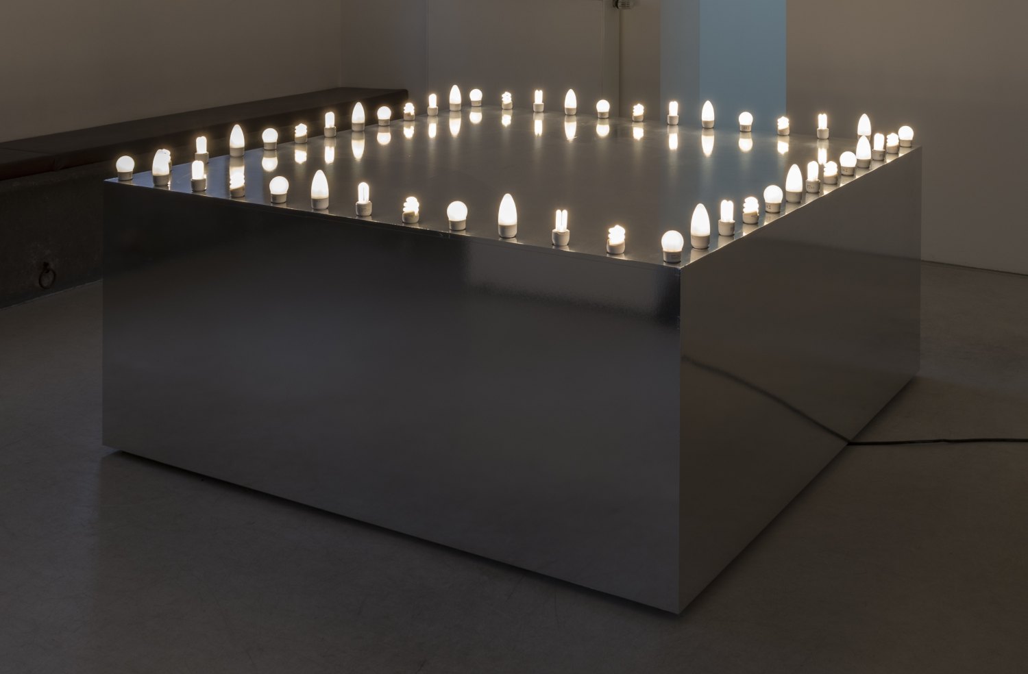 Karl Holmqvist Untitled (Go-go platform), 2012 Laminated chipboard, mirror foil, 72 lamps, 169 × 169 × 70 cm